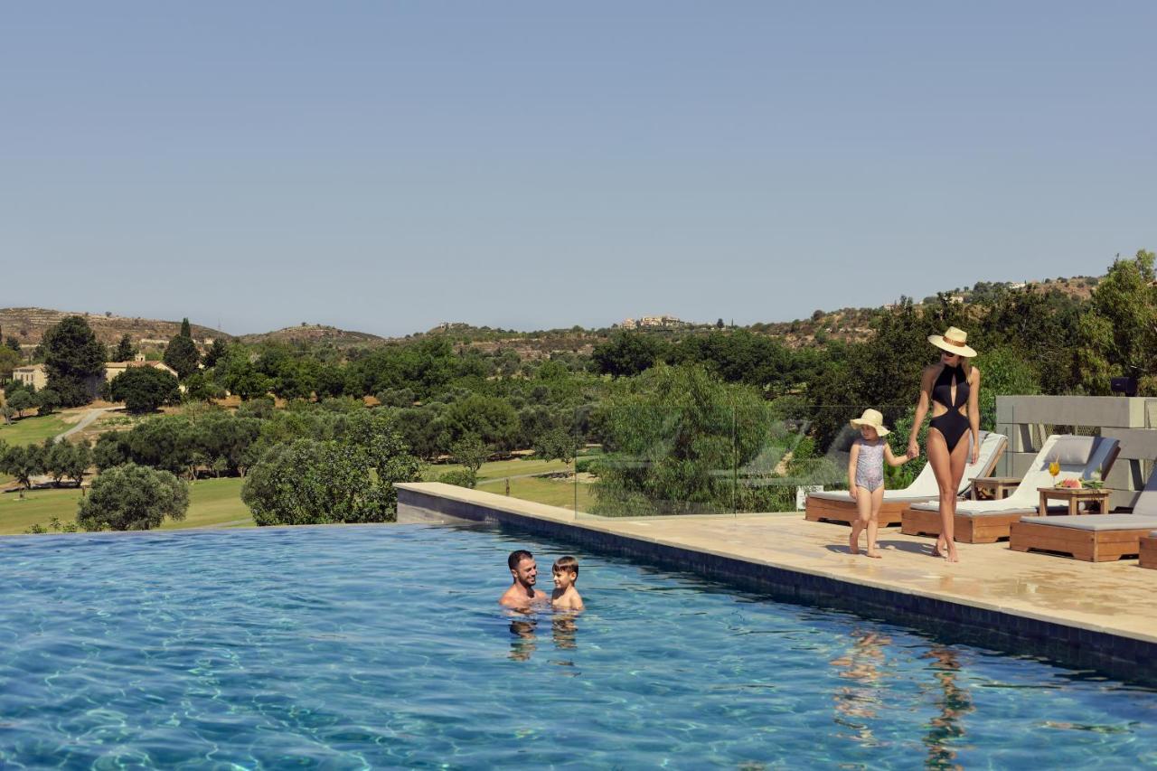 Minthis Resort Tsadha Bagian luar foto The pool at the hotel