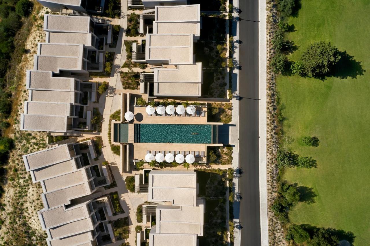 Minthis Resort Tsadha Bagian luar foto Aerial view of the hotel